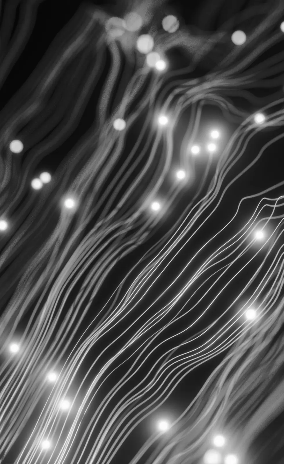 Fibre-optic strands carrying points of light through the dark
