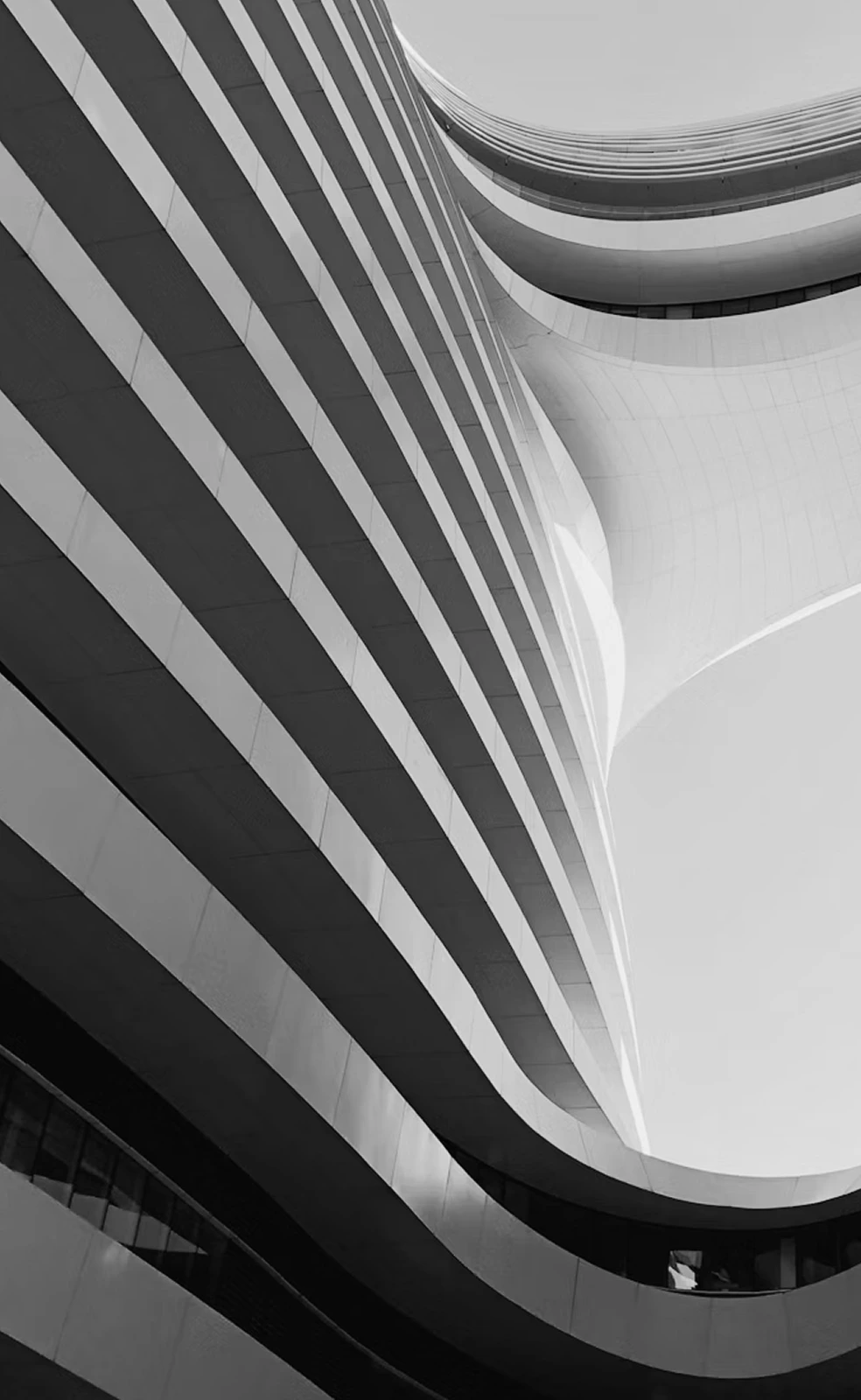 Curved building façade in stacked horizontal bands