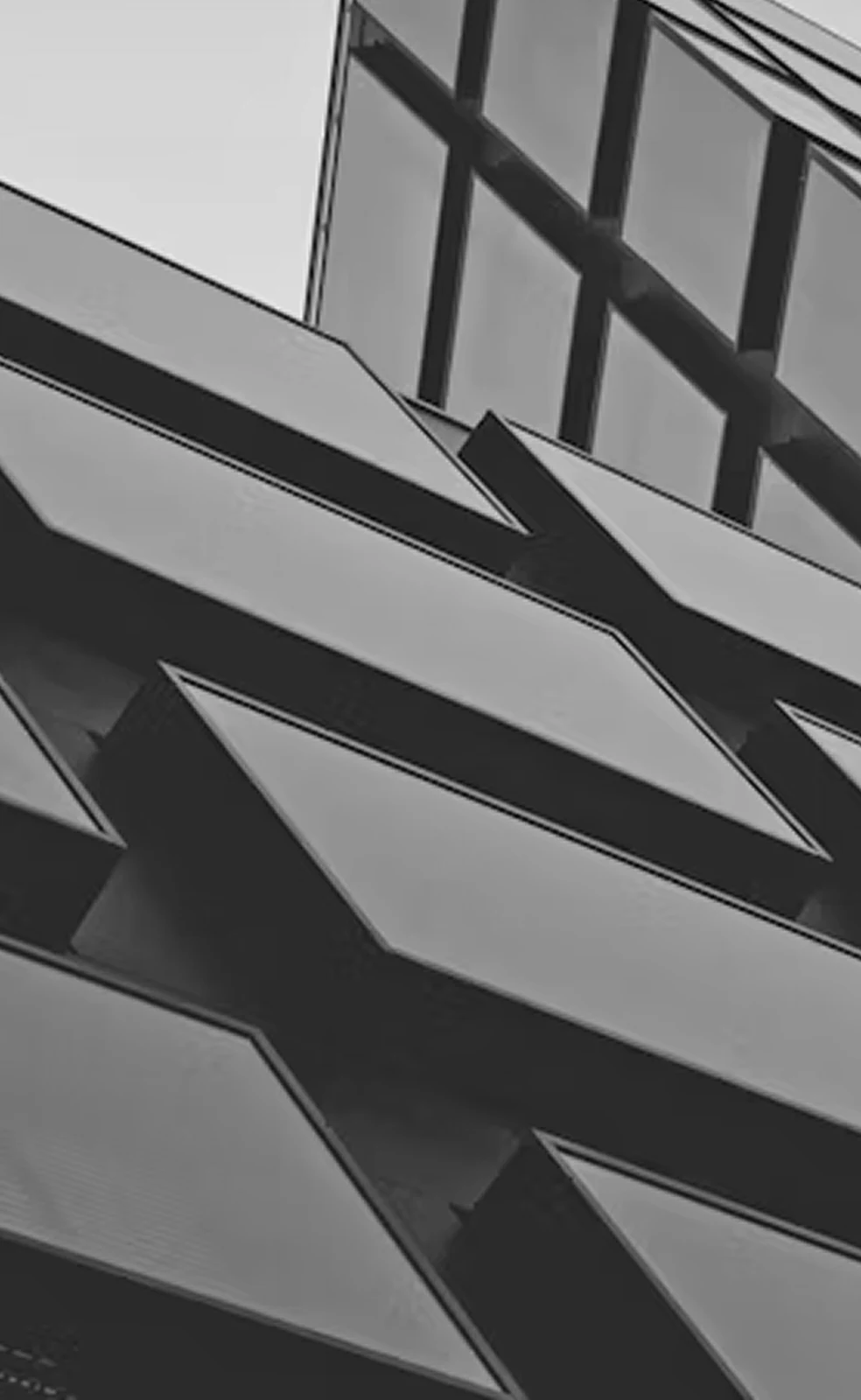 Angular glass and steel façade seen from below